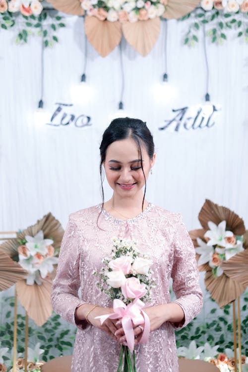 Cute Bride with Bouquet in Hands