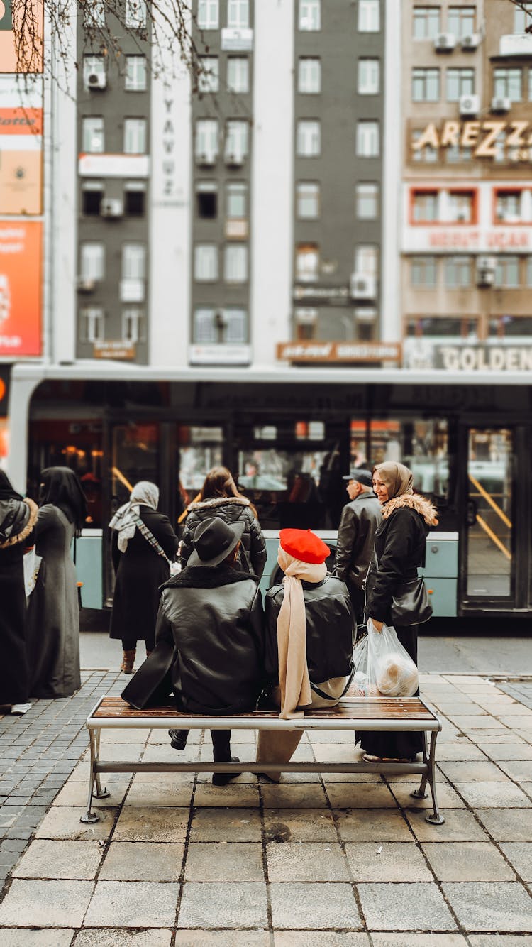 People Waiting For The Bus