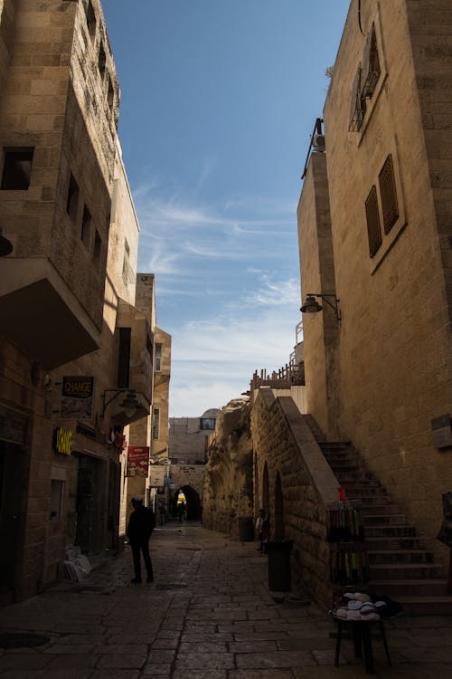 Brown Concrete Buildings Under Blue Sky