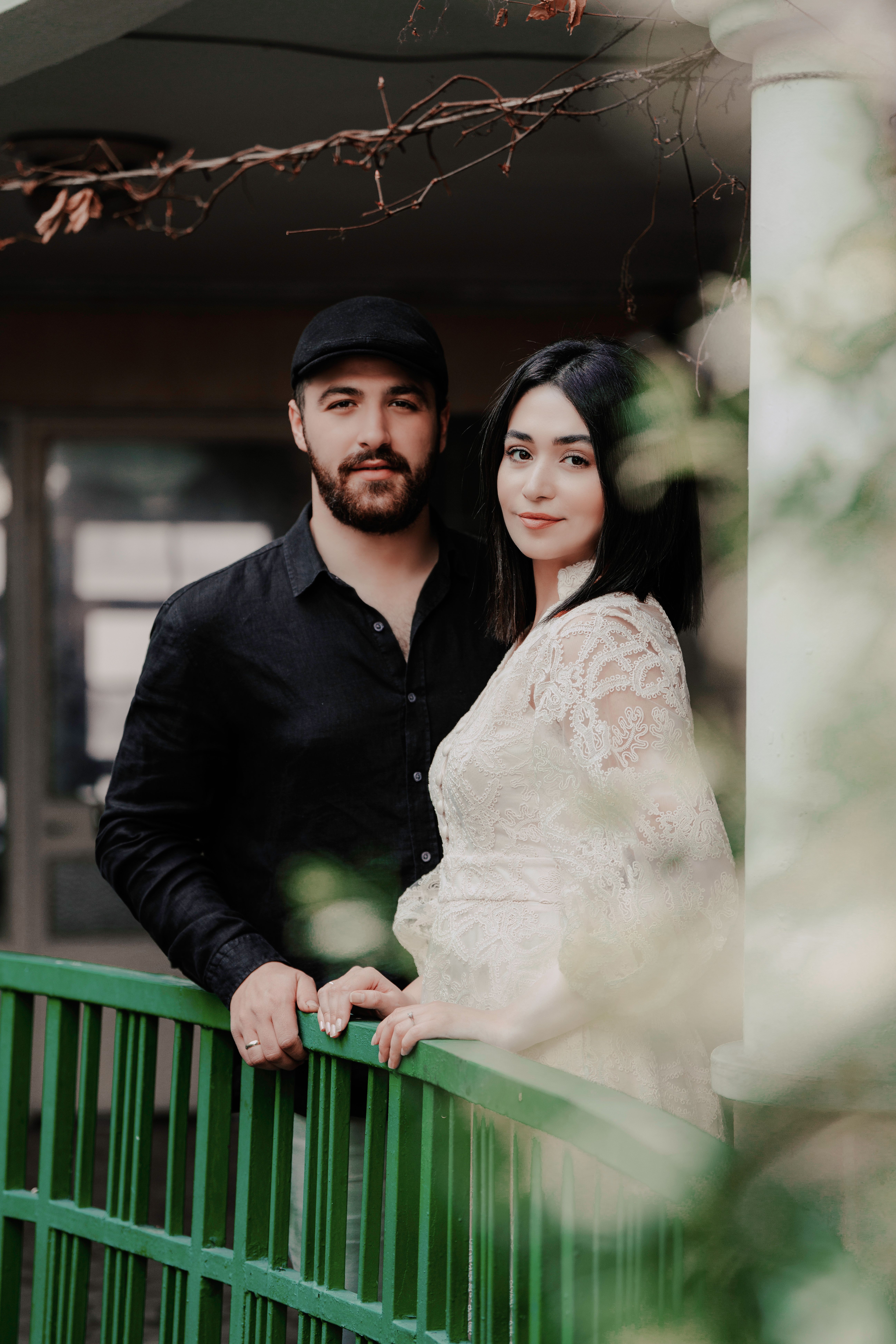 Couple Posing by Railing · Free Stock Photo