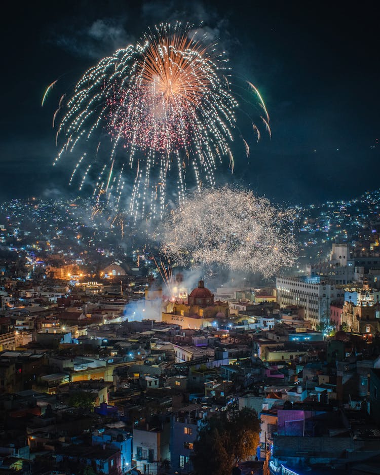 Fireworks Over City At Night