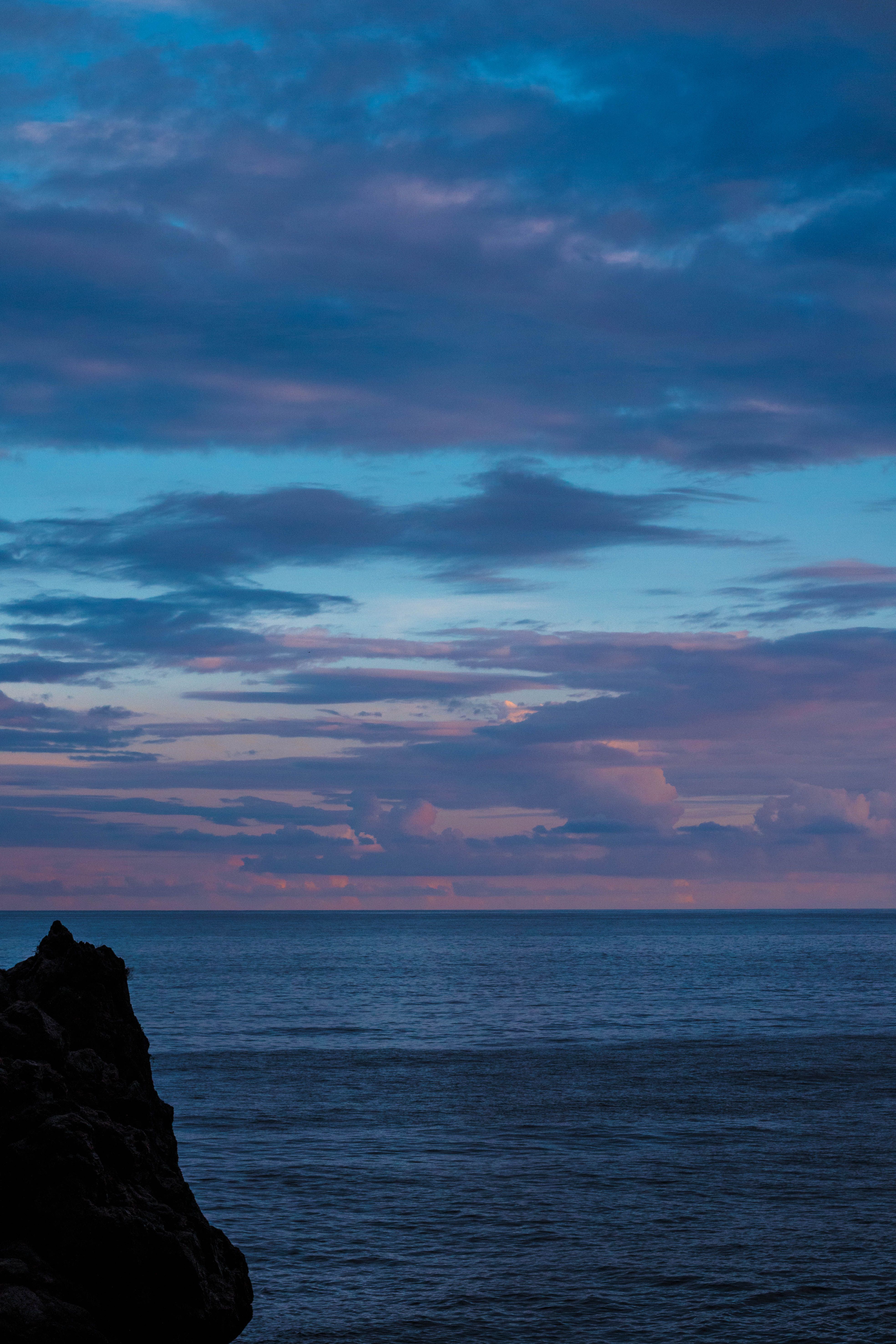 Clouds over Sea Coast at Dusk · Free Stock Photo