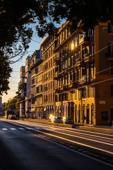 Quiet urban street at sunset with historic building facades, creating a serene city ambiance.