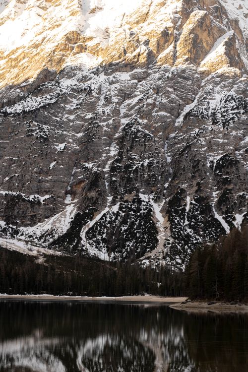 Free Stunning view of a snowcapped mountain reflecting in a calm lake, creating a serene landscape. Stock Photo