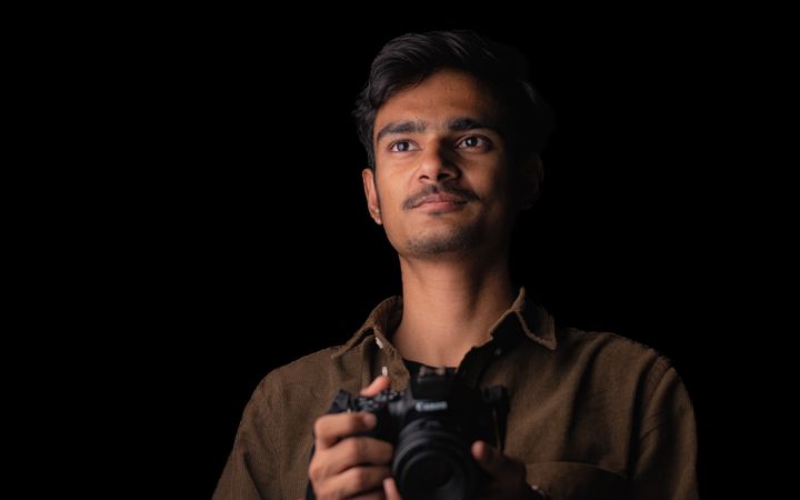 A photographer with his camera