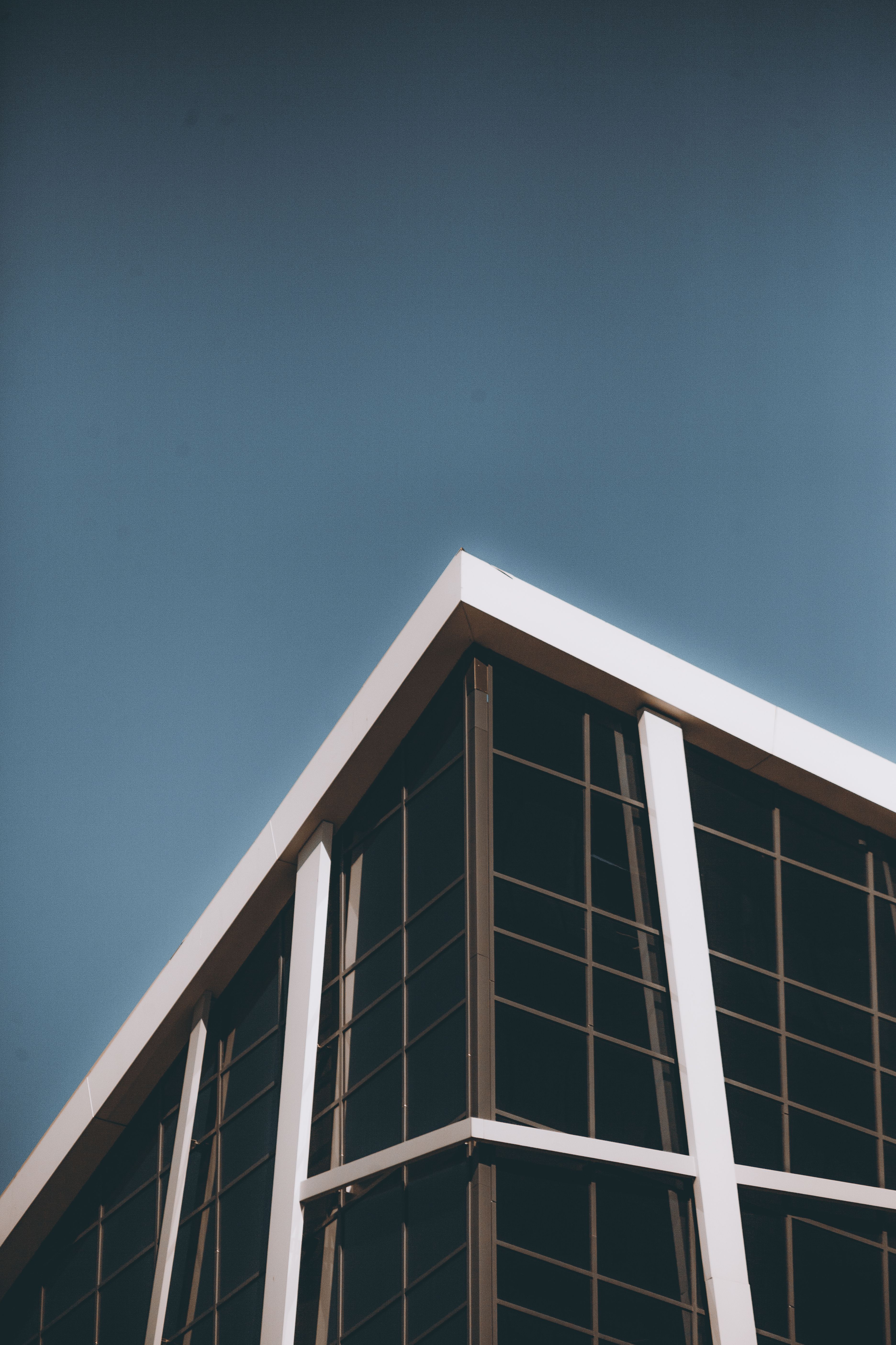 Low Angle Shot of a Modern Building Exterior under Blue Sky · Free ...
