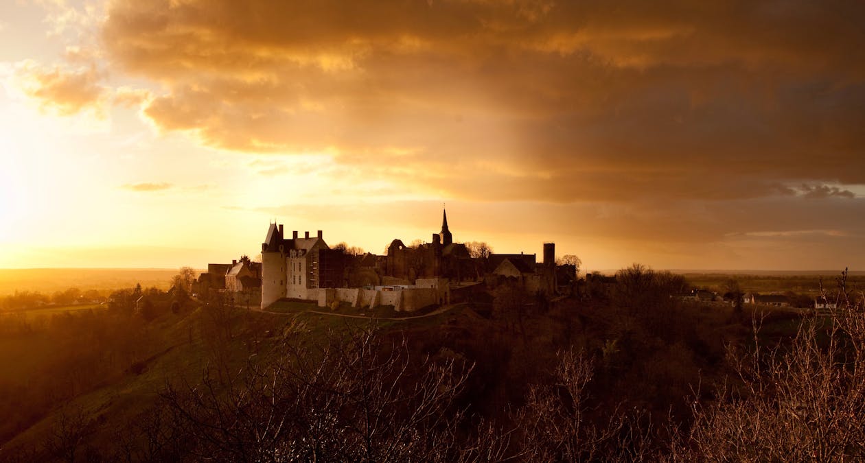 Free Castle on Top of Hill at Sunset Stock Photo