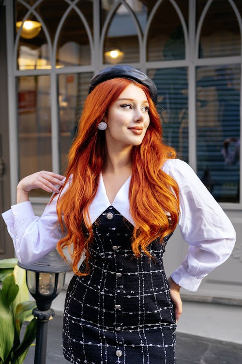 Woman Standing in Retro Dress and Leather Beret