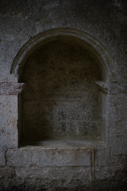 Free A textured stone niche in the ruins of the historical Abbey of San Galgano, Italy. Stock Photo
