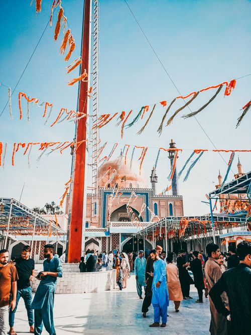 Free A lively scene at the renowned Lal Shahbaz Qalandar Shrine, capturing cultural and architectural beauty. Stock Photo