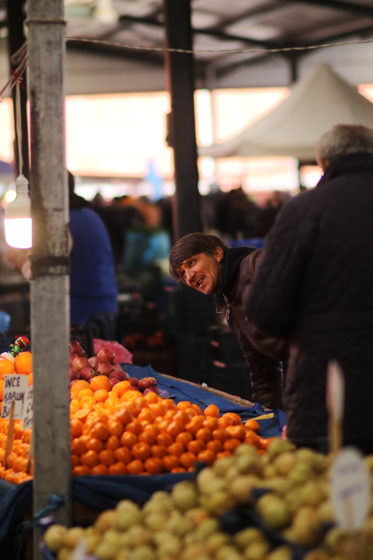 Merchant At Stall With Fruits