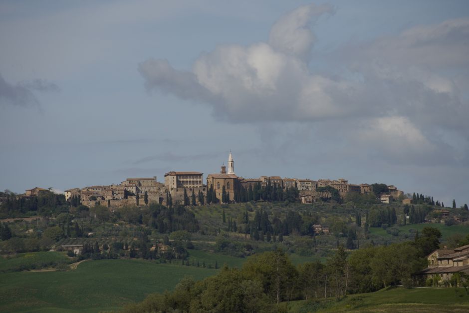 A panoramic view of the historic town of Pienza, Tuscany, with Renaissance architecture.