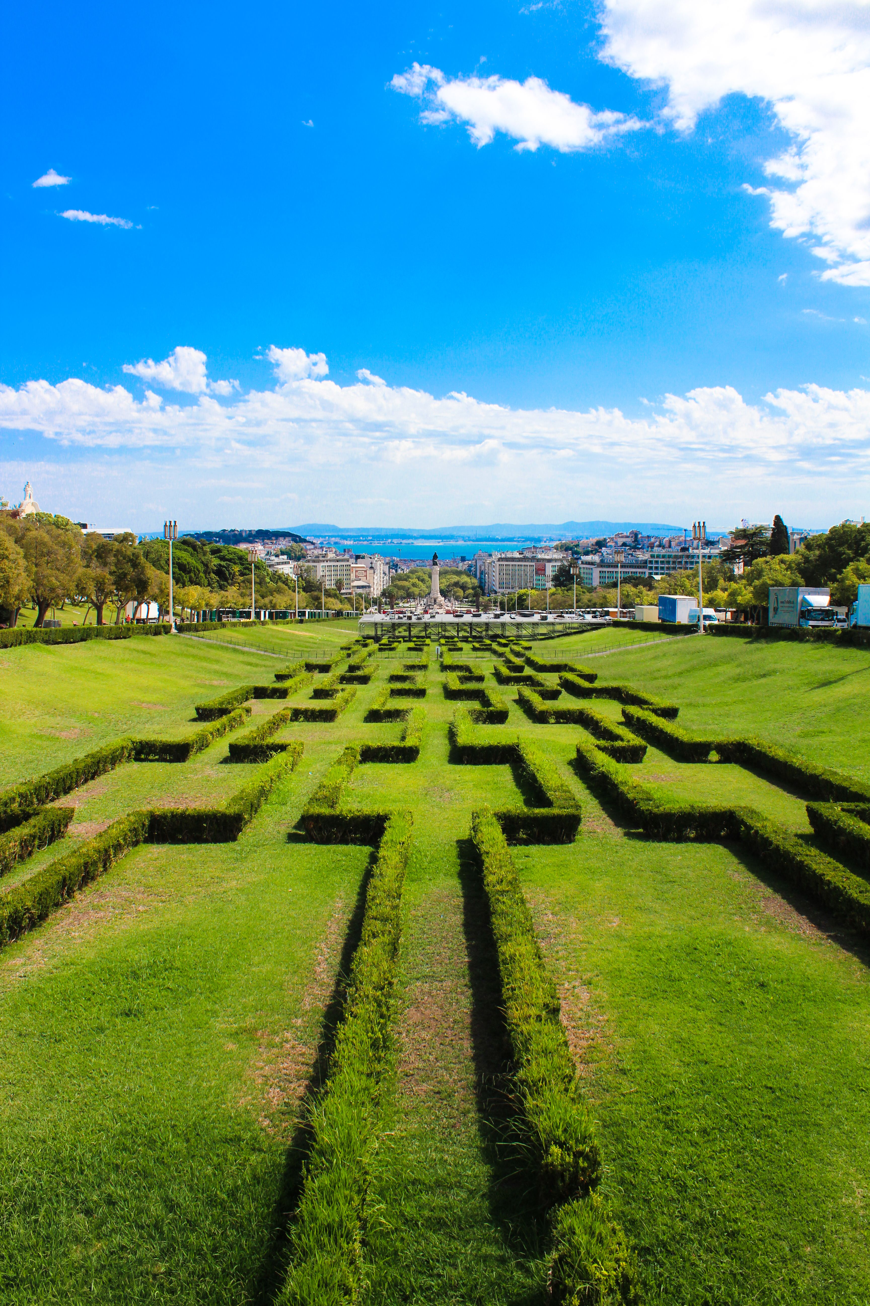 Vibrant aerial shot of Eduardo VII Park with geometric hedges in Lisbon, Portugal.