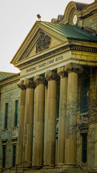 Photo by Jem Photography Classic façade of Frontenac County Court House, showcasing neoclassical architecture in Kingston, Ontario.