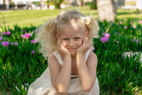 Portrait of a Blonde Girl in a Park 