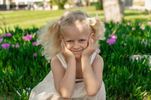 Free Portrait of a Blonde Girl in a Park  Stock Photo