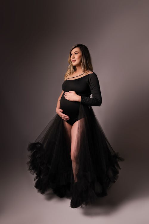 Woman Posing in Black Dress