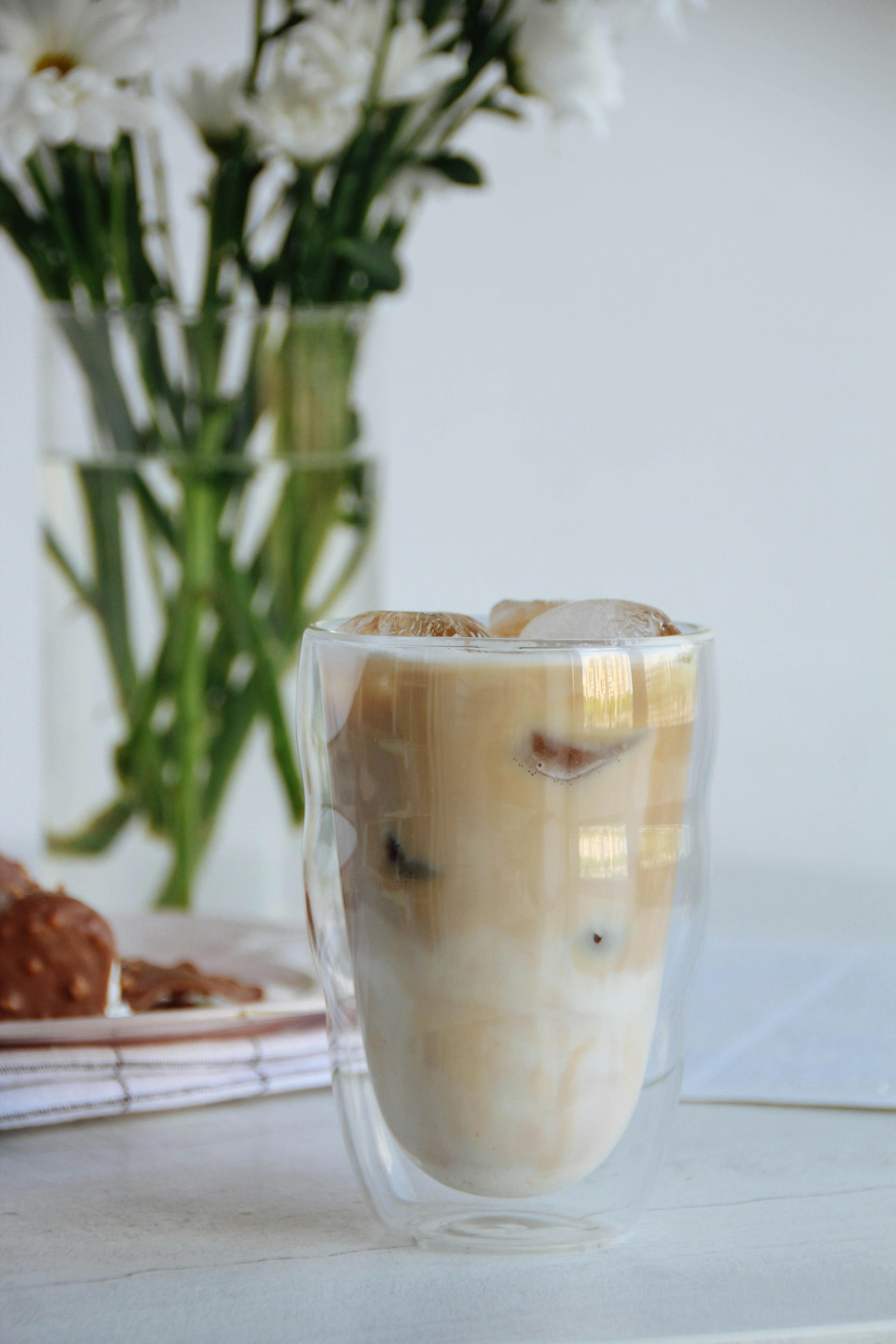 A Glass Jar Of Iced Coffee On The Table Stock Photo, Picture and