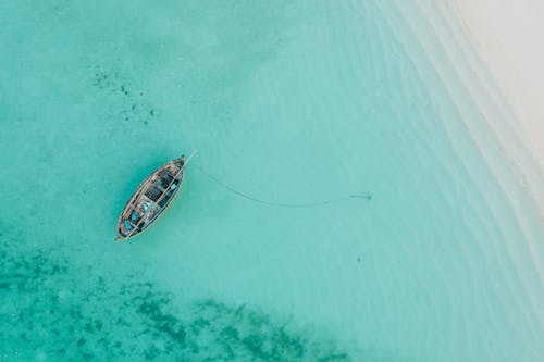 Top View of a Boat Anchored near the Coast 