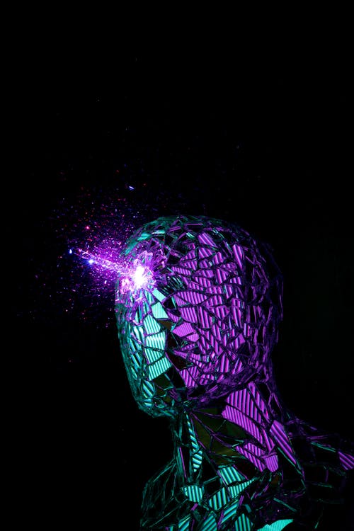 A man with a glowing head and purple lights