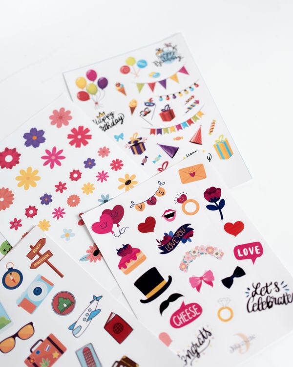 Sheets of colourful paper stickers — photo by Mohamed hamdi on Pexels