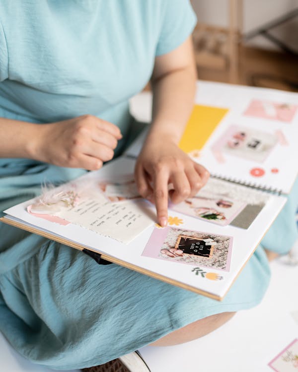 Free Woman Holding a Scrapbook Stock Photo