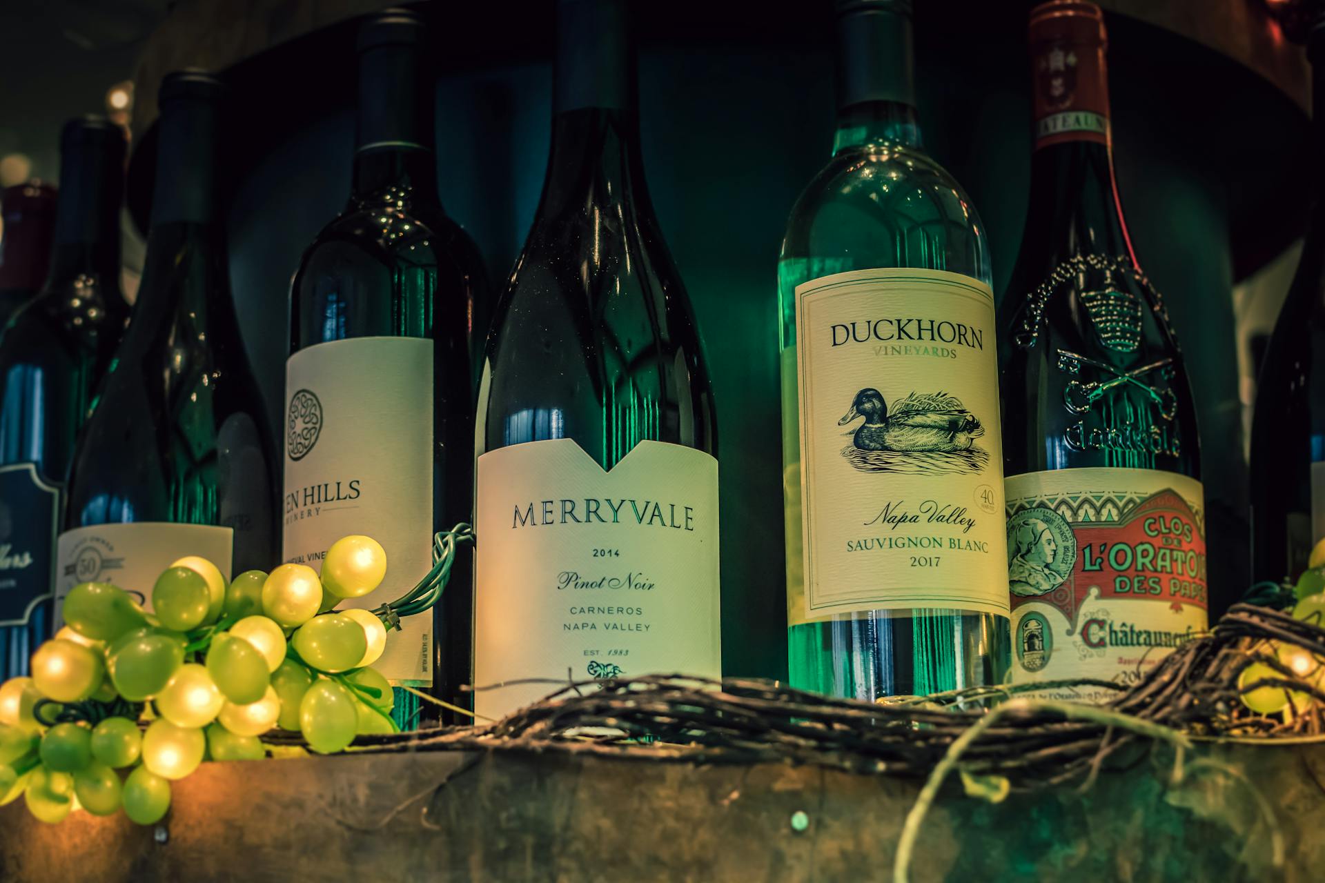 Five Assorted-variety Labeled Bottles