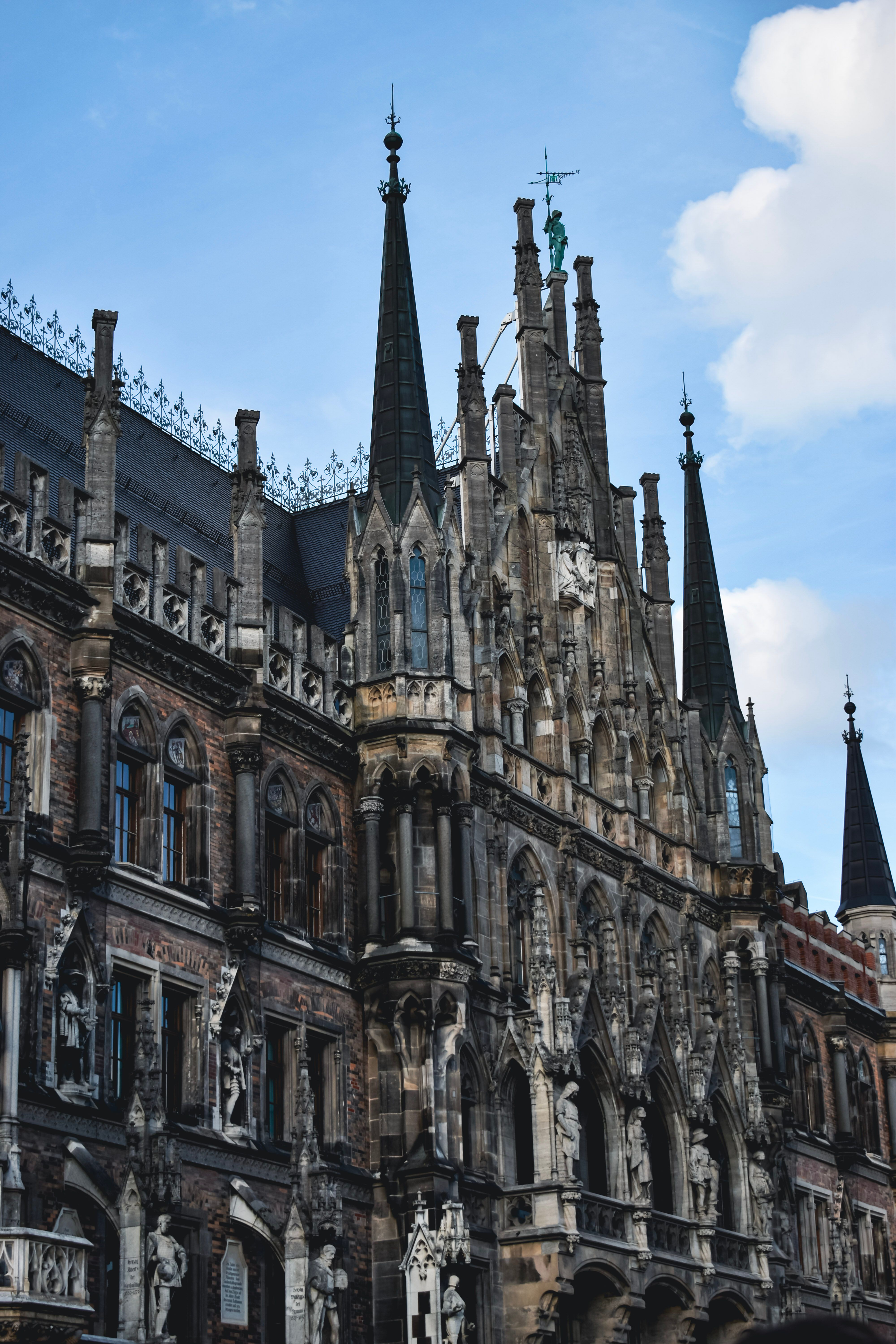 Free Stunning Gothic architecture of the Munich Town Hall in Germany under a blue sky. Stock Photo