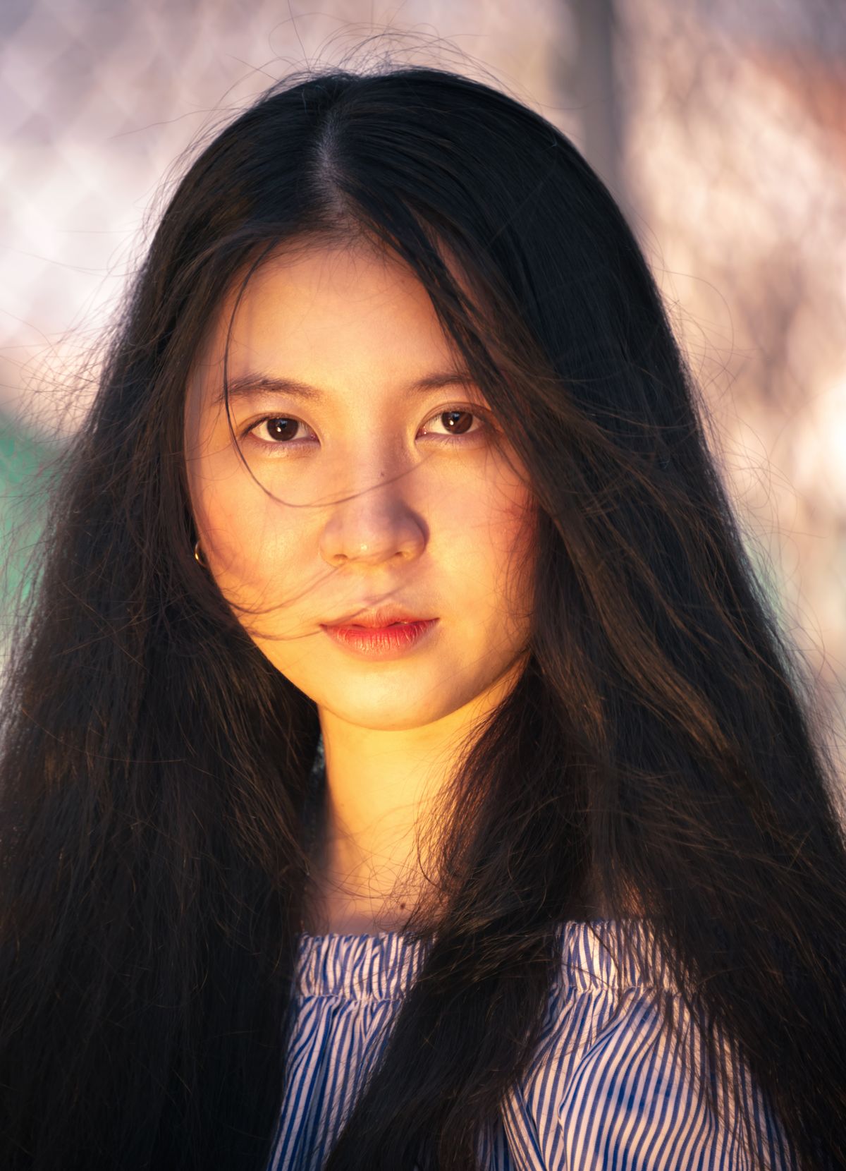 Close-up portrait of woman with radiant glowing skin in natural light