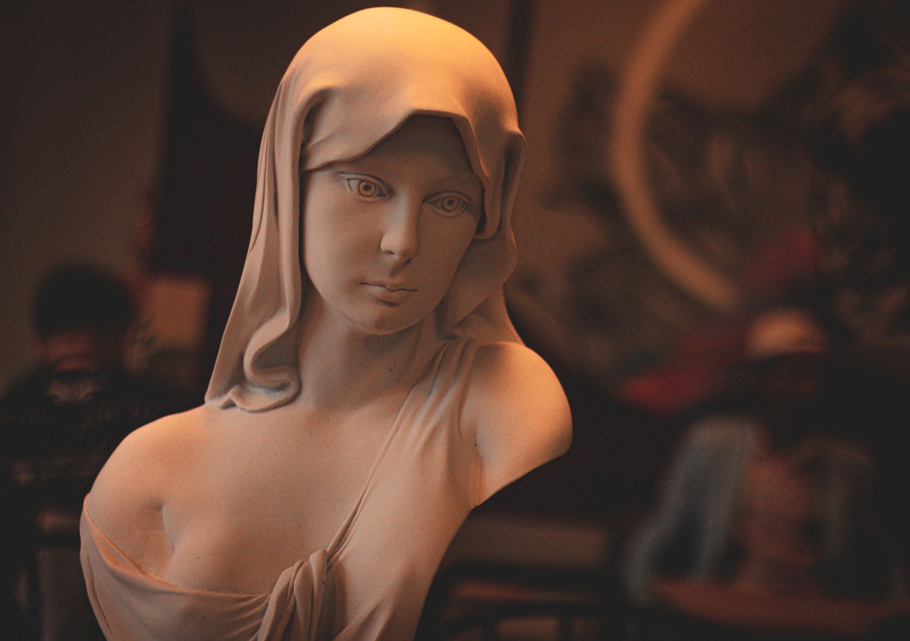 A close-up view of a serene Holy Mary sculpture, capturing religious artistry indoors.