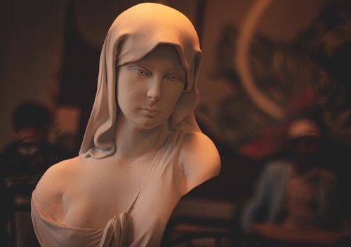 Free A close-up view of a serene Holy Mary sculpture, capturing religious artistry indoors. Stock Photo