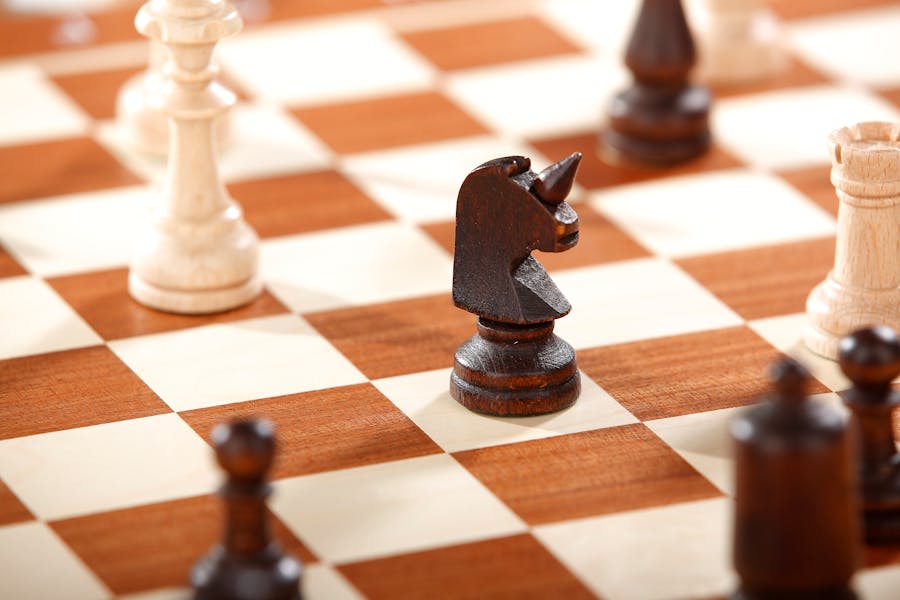 Family enjoying a game of Checkers