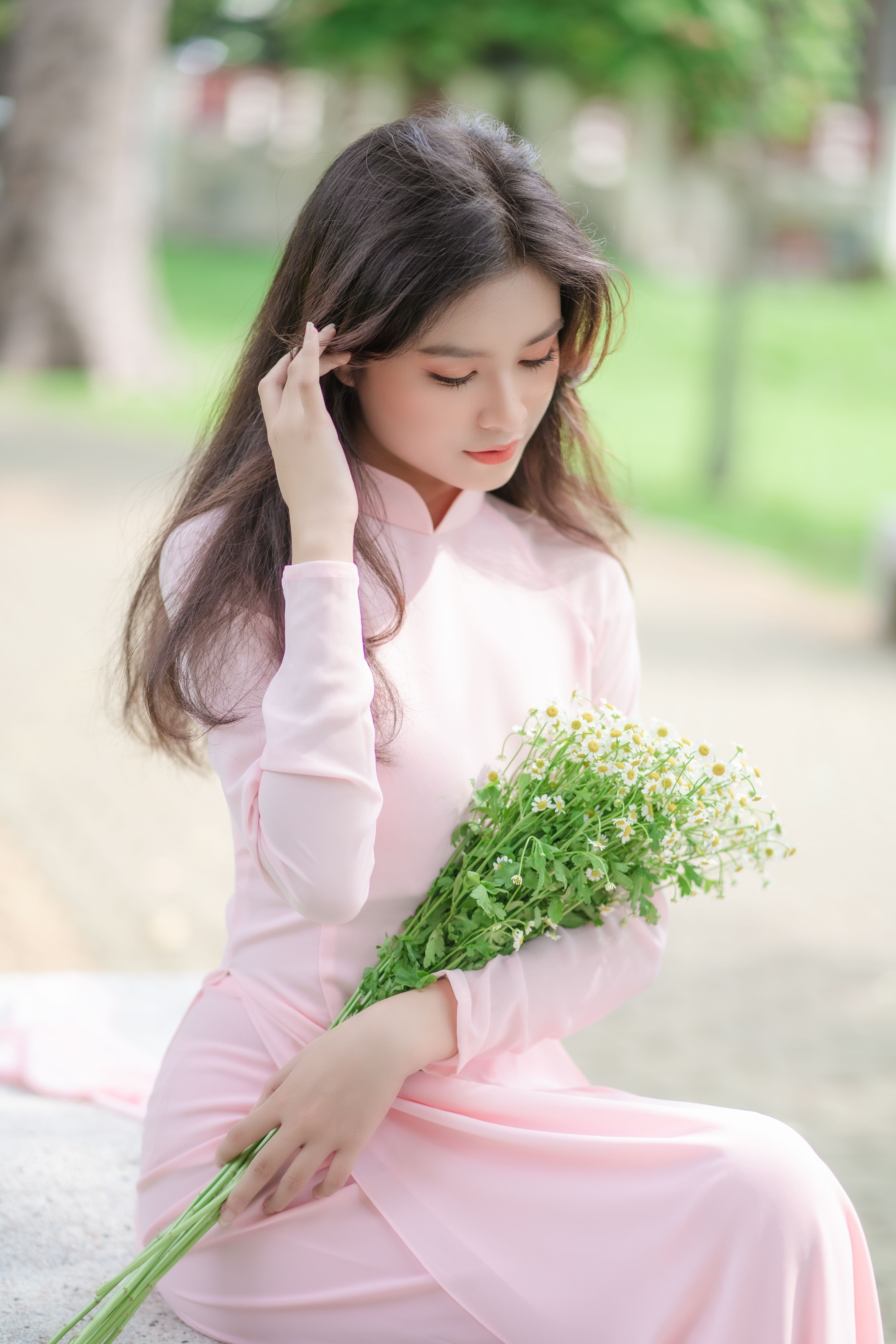 Woman in Pink Dress Sitting with Flowers · Free Stock Photo