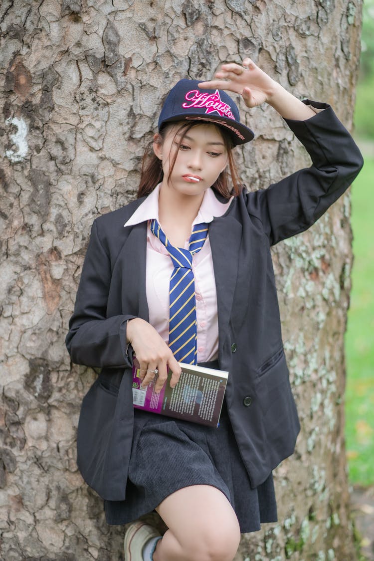 Woman In Black Suit Posing With Book