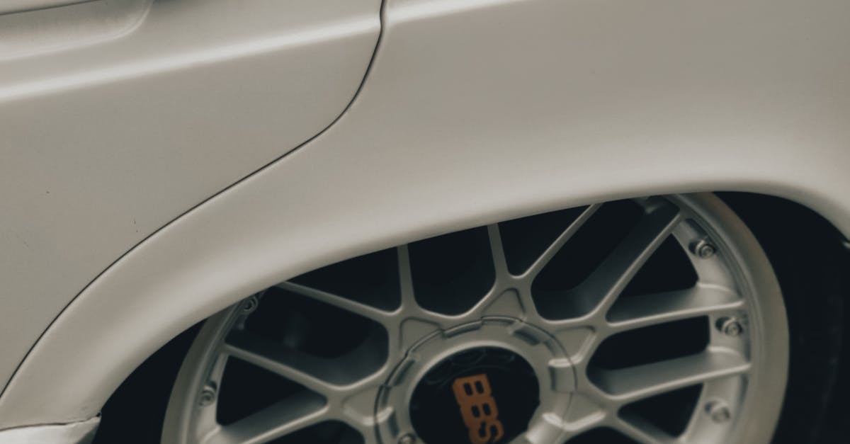 Close-up of Silver Rims on a Vintage White Mercedes · Free Stock Photo