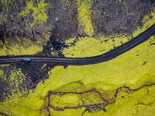 Free Aerial Photography of Blue Vehicle at Road Stock Photo