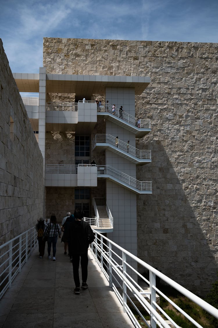 People Walking On The Premises Of The Getty, An Art Museum In Los Angeles, California 