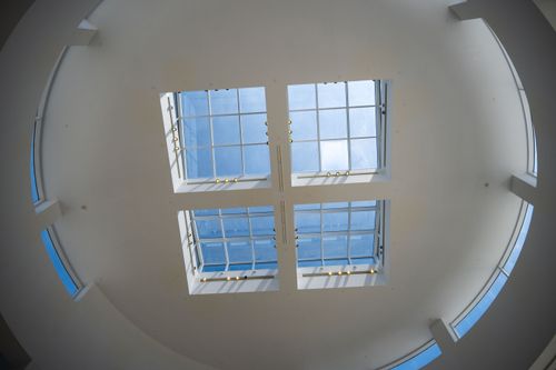 Free Elegant modern skylight framing a clear blue sky, showcasing contemporary architecture style. Stock Photo