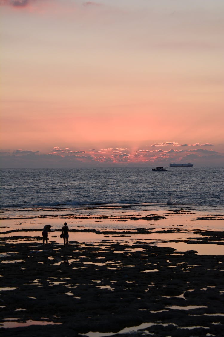 People On Beach At Dawn