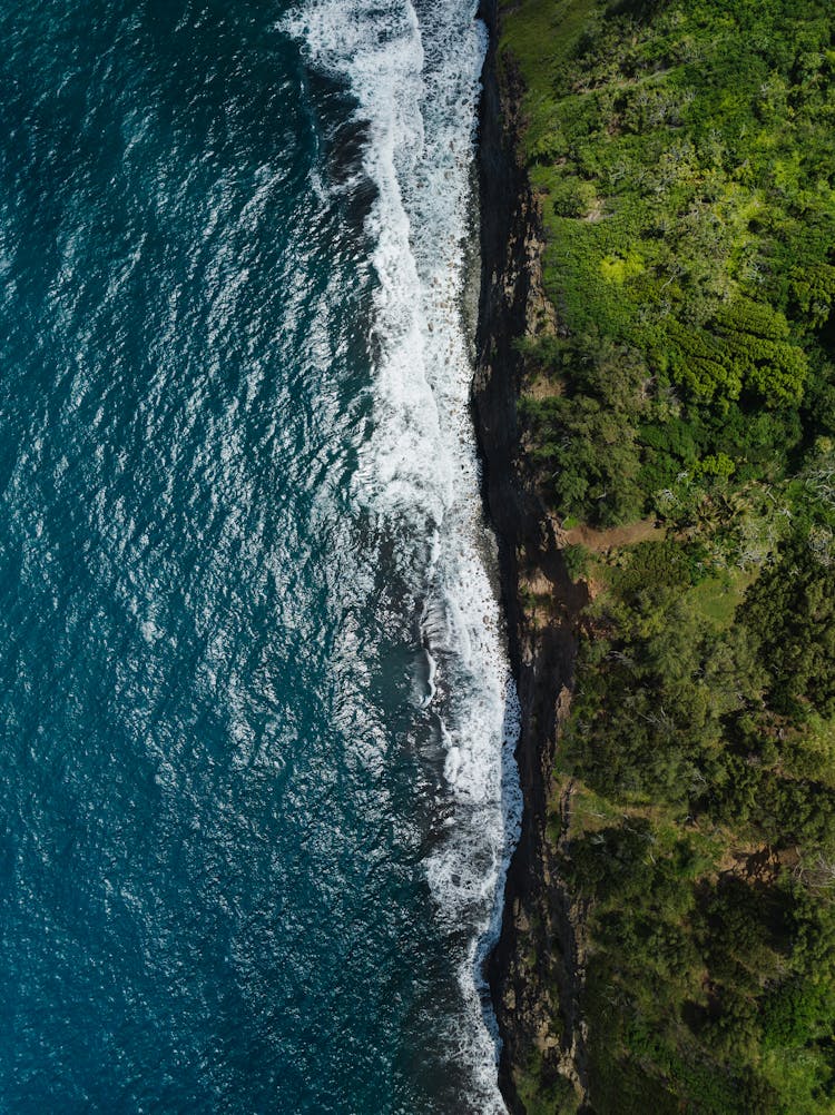 Wave Crashing On Cliff