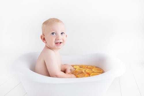Free stock photo of baby, oranges Stock Photo
