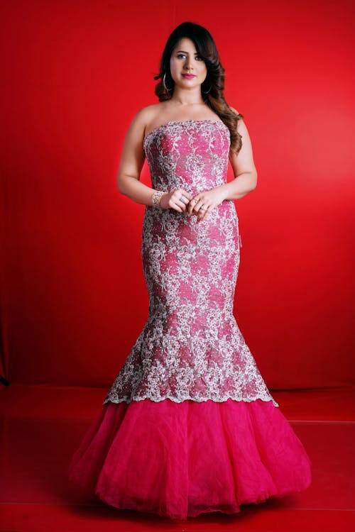 Studio Shot of a Young Brunette in an Elegant Dress 