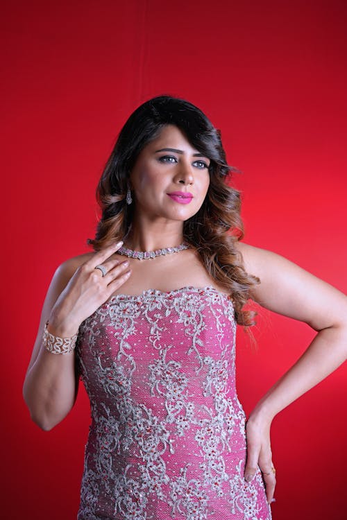 Studio Portrait of a Female Model Wearing a Pink Dress