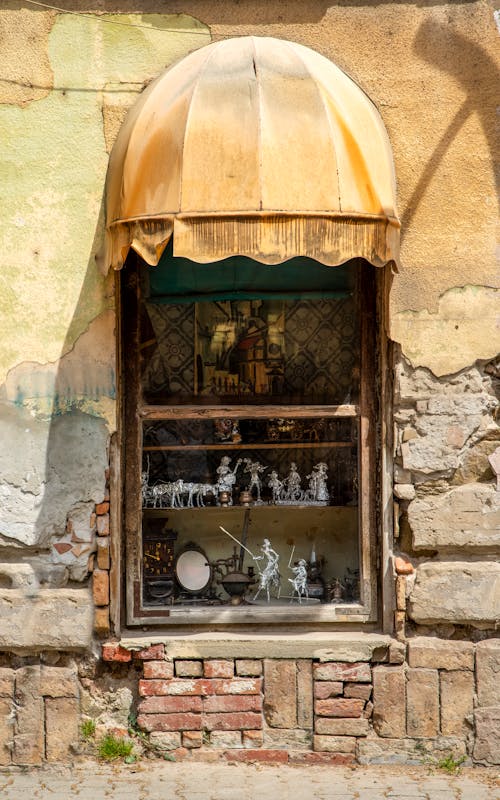 Various Figurines behind a Store Window