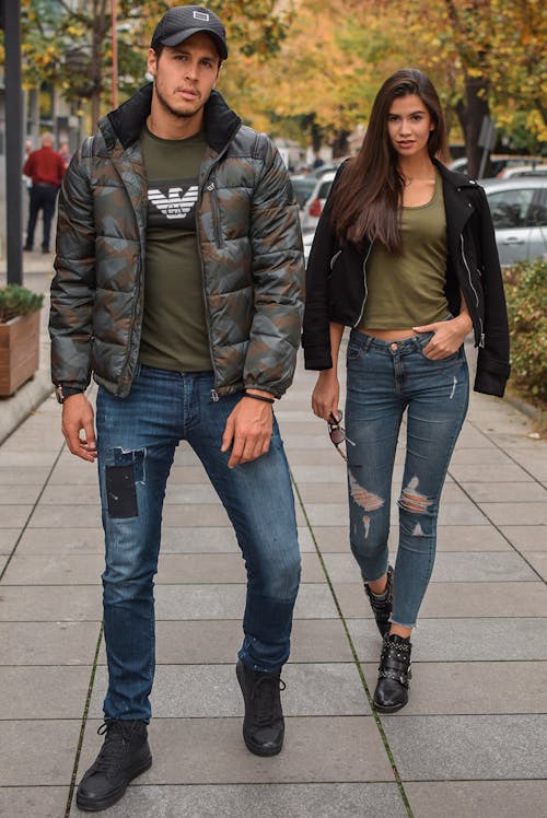 Photo Of Man And Woman Standing On Pavement