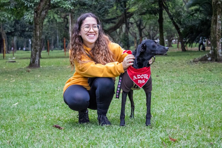 Smiling Woman With Black Dog