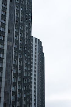 Tall modern skyscrapers in an urban skyline with a clear sky backdrop, highlighting contemporary architecture.