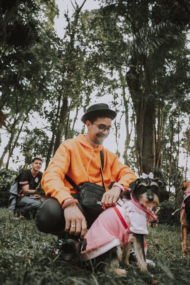 Smiling Man With Dog In Clothes