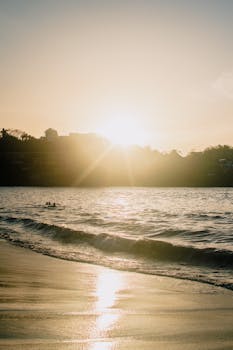 Stunning sunset over Sayulita's serene beach in Mexico, capturing the peaceful waves and golden sky.