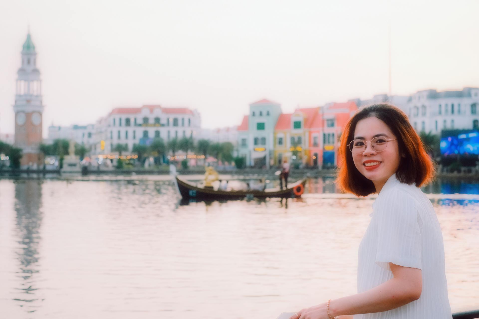 Young Woman Standing next to a Body of Water in the Grand World Phu Quoc in Vietman